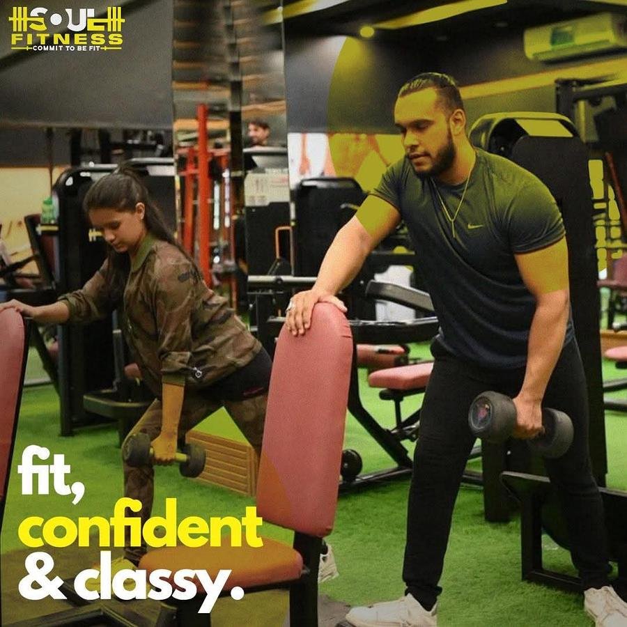 Trainer coaching a member
